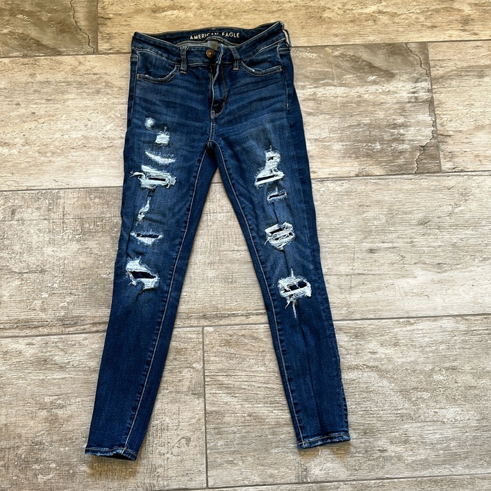 American Eagle size 4 dark Jeggings. Holes are covered, not open.